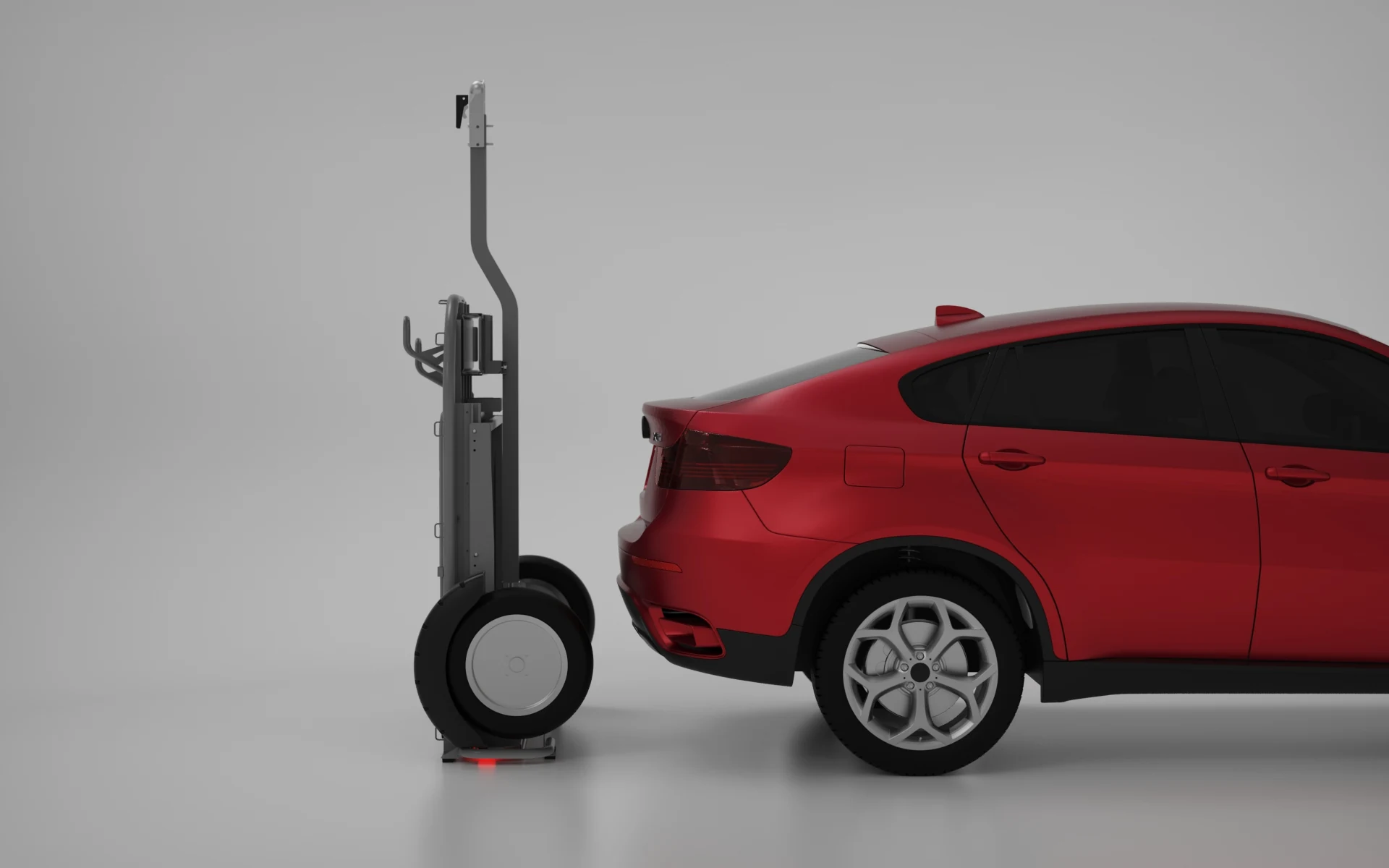 Folded Camaleonic trailer stored upright beside a modern SUV